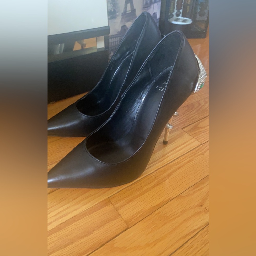 Black heels with snake wrapping around heel